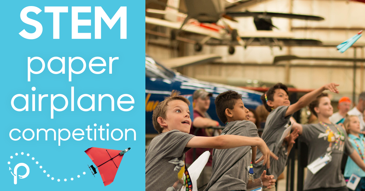 Kids throwing paper airplanes for a STEM competition